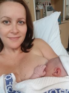 Hypnobirthing Mum Sarah holding her newborn baby