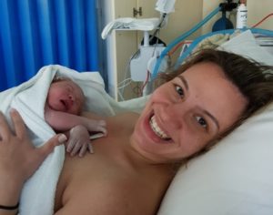 Smiling Hypnomum Tash holding her baby