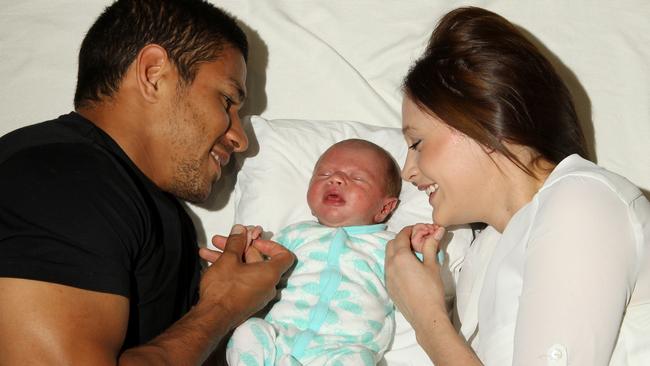 Gold Coast Titans player David Mead with his wife Taneal with their newborn son Paxton. Picture: Scott Fletcher