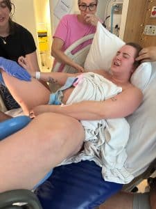 women birthing her baby in hospital