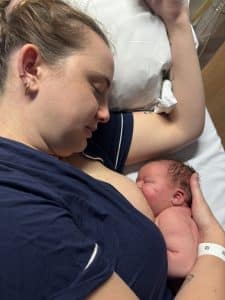women breastfeeding her baby after birth