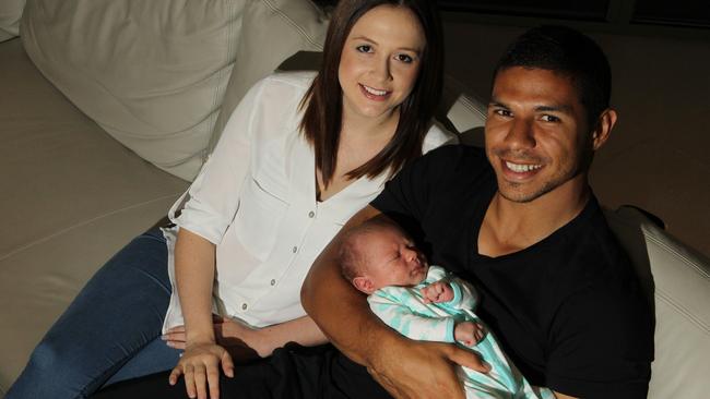 Gold Coast Titans player David Mead with his wife Taneal with their newborn son Paxton. Picture: Scott Fletcher