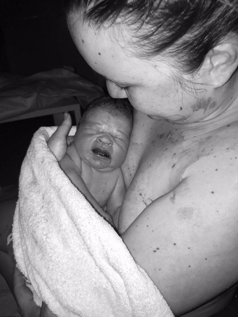 Mum Martina holding her newborn baby 