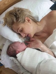 Erin laying with baby Odette