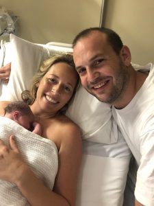 Hypnobirthing Mum Tess and husband holding newborn baby 