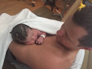 Hypnobirthing Australia Dad having Skin to Skin with baby