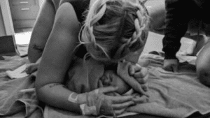 Mother-meeting-baby-baby-wrapped-in-towel-